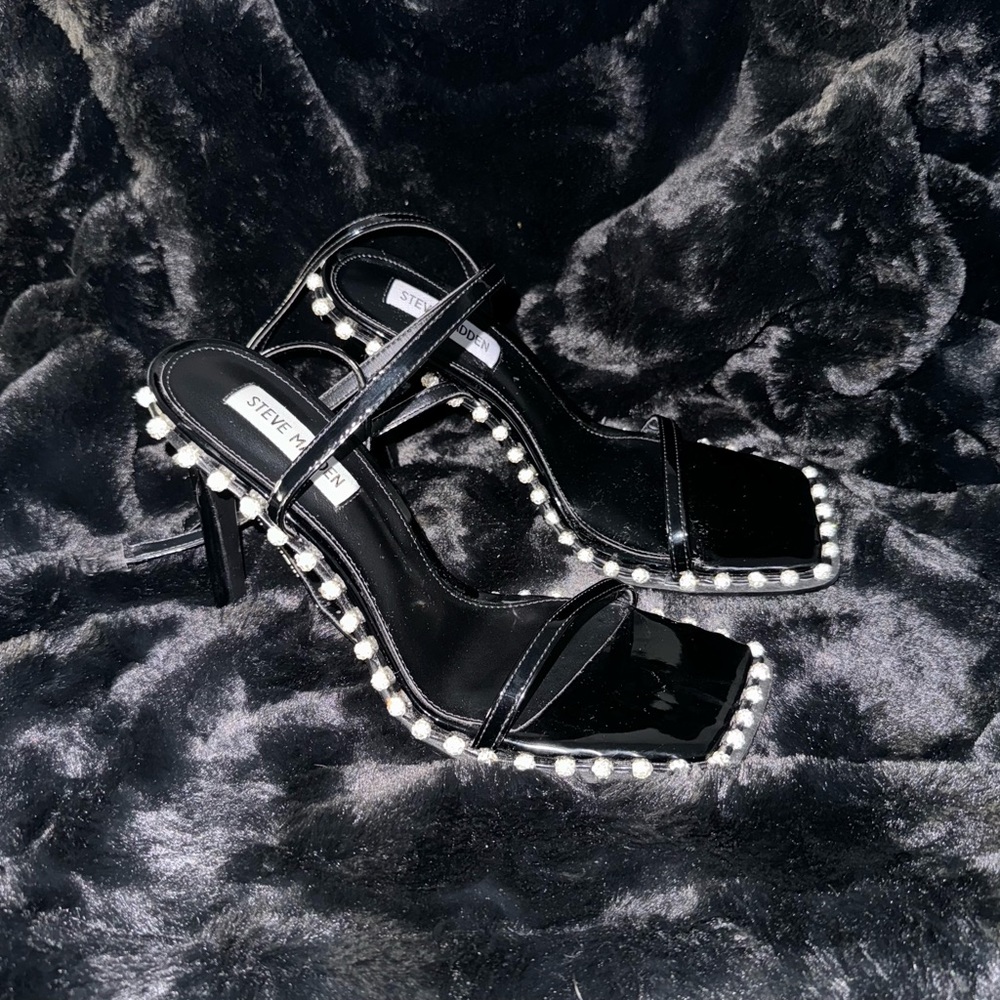 Classic black squared open toed shoes.